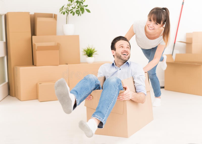young-people-move-new-apartment-couple-have-fun-moving-to-boy-pushes-box-girl-happy-house-87756628